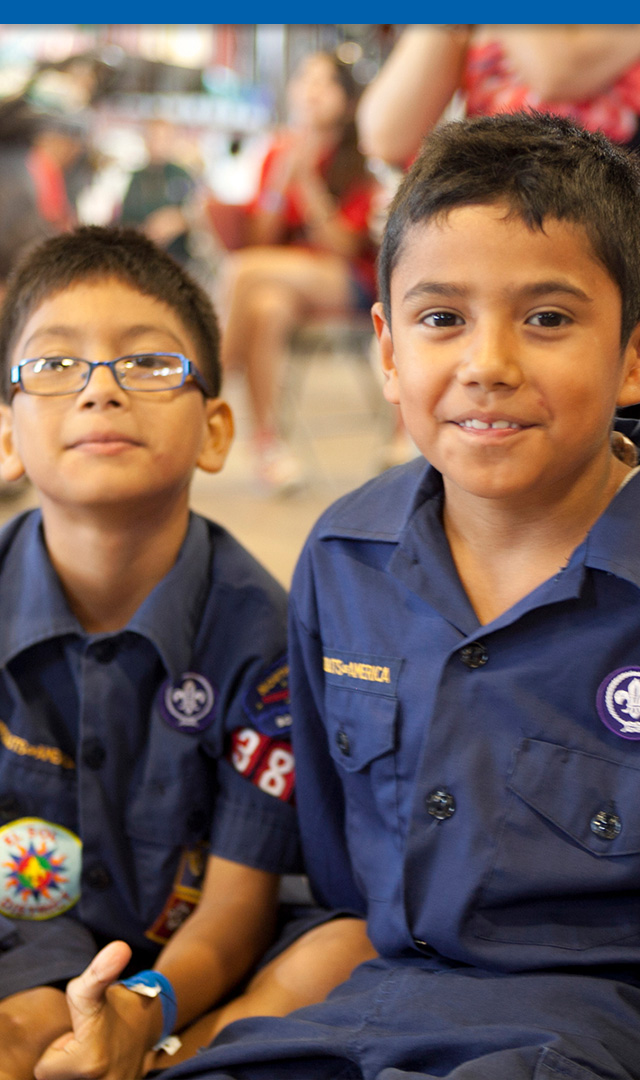 Two Cub Scouts smiling at the camera